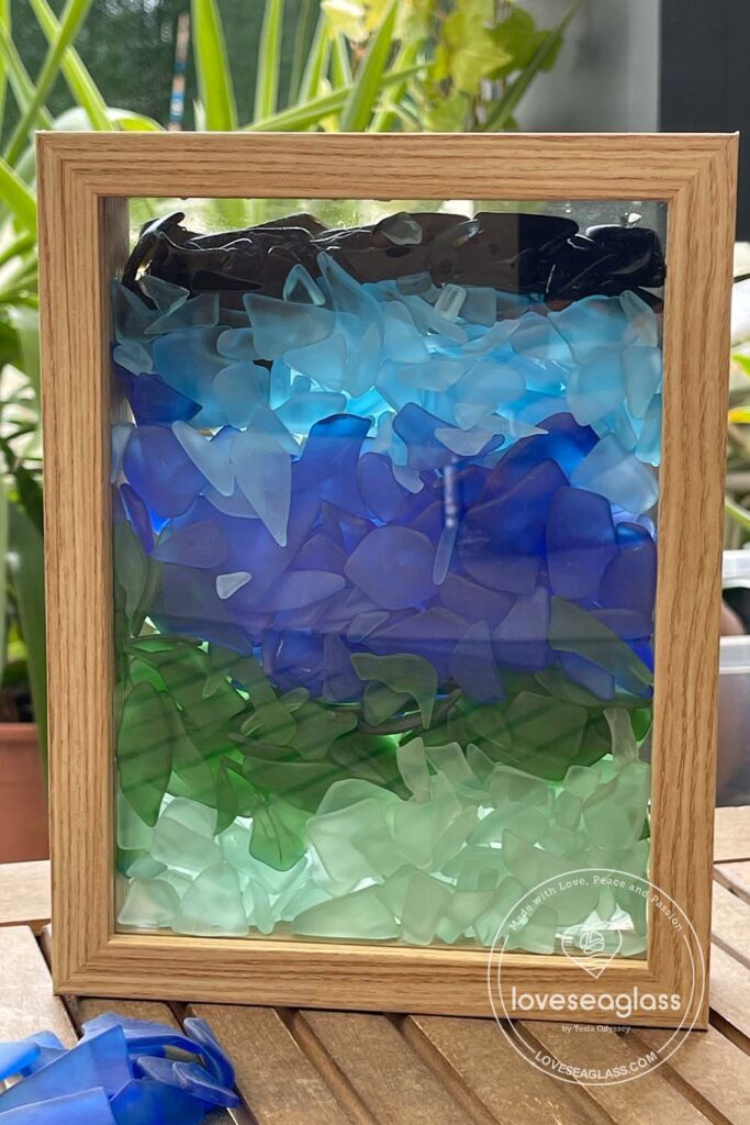 beach glass in a glass frame